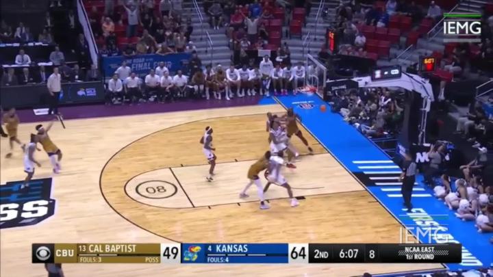 Basketball Players Playing on the Court